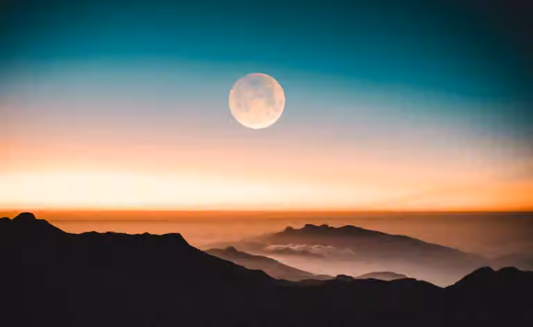 Moon over mountains